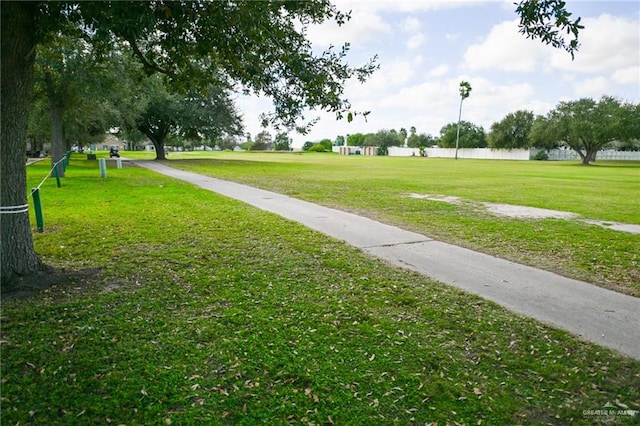 view of property's community with a yard