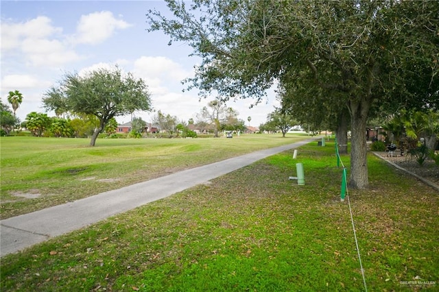 view of property's community featuring a yard