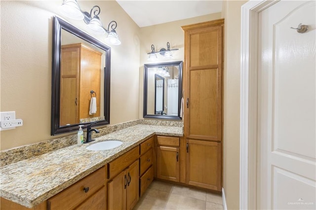 bathroom with vanity and tile patterned flooring