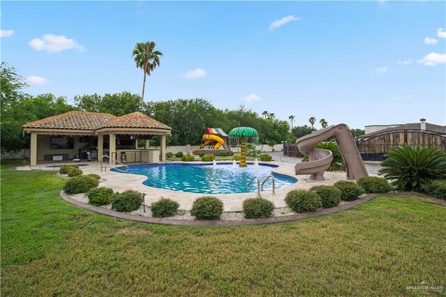 1802 E Thompson Rd, Mission, TX 78573 - swimming pool with a gazebo, a water slide, a patio area, and a yard