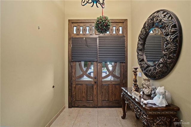 1802 E Thompson Rd, Mission, TX 78573 - foyer entrance featuring baseboards and light tile patterned floors