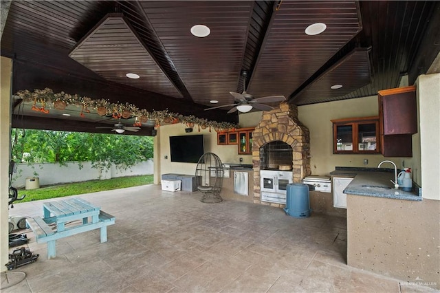 1802 E Thompson Rd, Mission, TX 78573 - view of patio with exterior kitchen and a ceiling fan