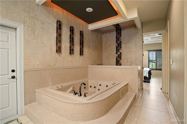 1802 E Thompson Rd, Mission, TX 78573 - ensuite bathroom with a jetted tub, tile patterned flooring, and tile walls
