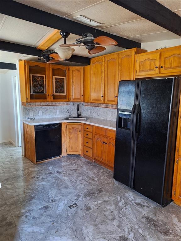 kitchen with ceiling fan, beamed ceiling, sink, and black appliances