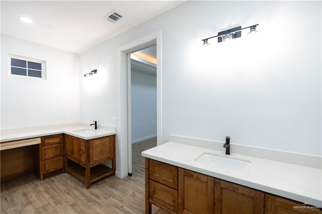 bathroom featuring hardwood / wood-style floors and vanity