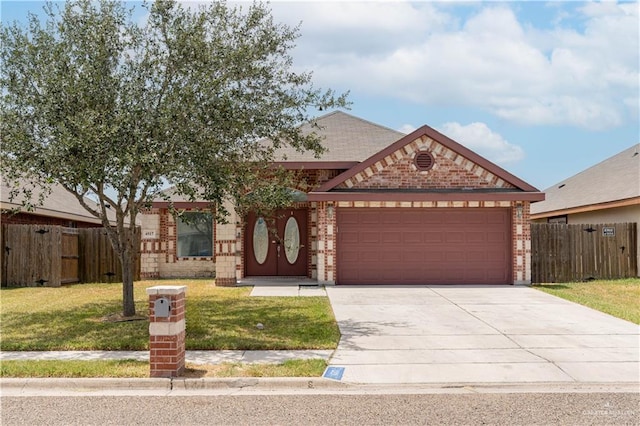 4517 Quail Ave, Mcallen, TX 78504 - view of front of property featuring brick siding, an attached garage, and concrete driveway