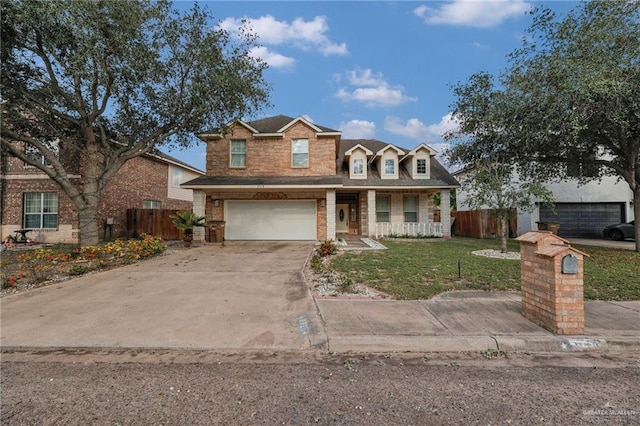 traditional-style house with covered porch, a garage, concrete driveway, and brick siding