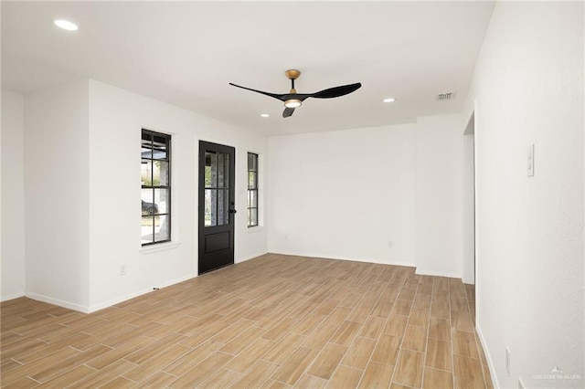 unfurnished room featuring recessed lighting, visible vents, baseboards, a ceiling fan, and light wood finished floors