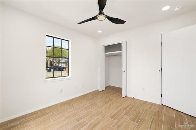 unfurnished bedroom featuring baseboards, ceiling fan, light wood-style floors, and recessed lighting