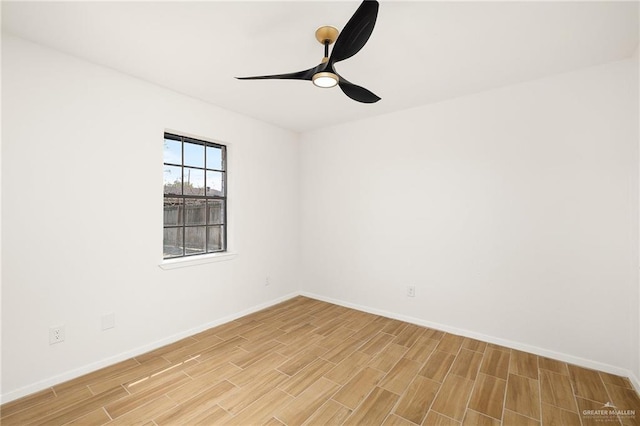 empty room featuring wood finish floors, ceiling fan, and baseboards