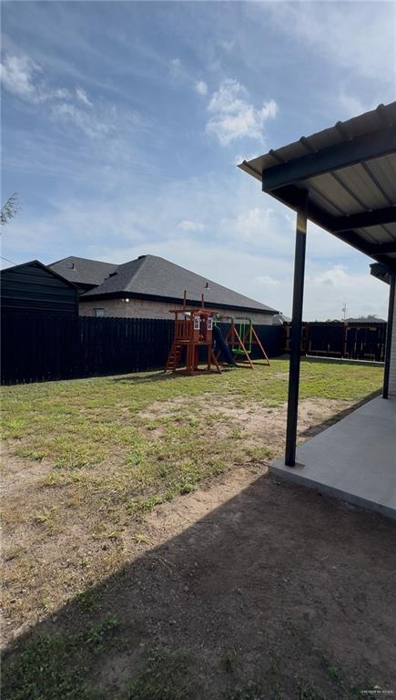 620 N Oaxaca St, Alton, TX 78573 - view of yard with a playground and a patio area