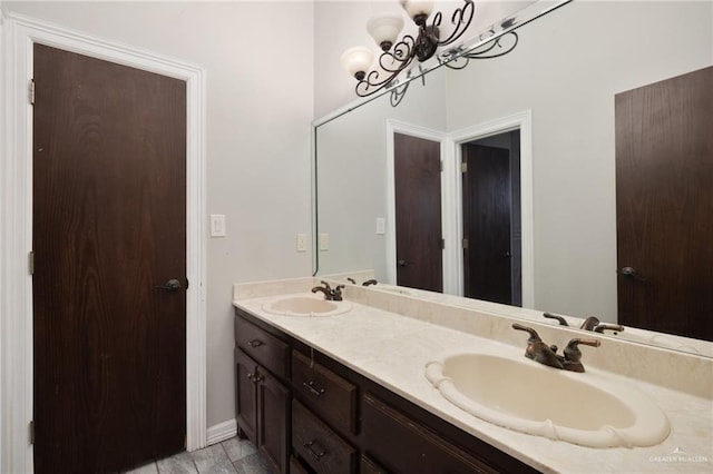 bathroom with vanity and an inviting chandelier