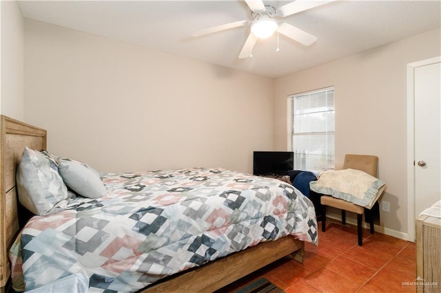 bedroom featuring light tile patterned floors and ceiling fan