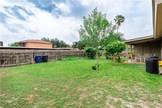 view of yard with a patio and a fenced backyard
