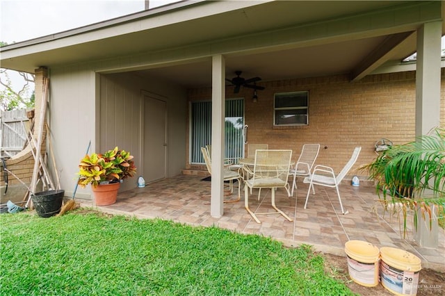 view of patio / terrace with fence and ceiling fan