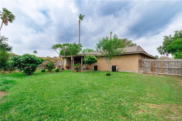 view of yard with a fenced backyard