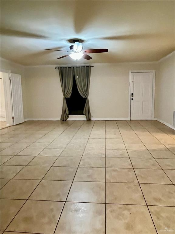 unfurnished room featuring light tile patterned flooring