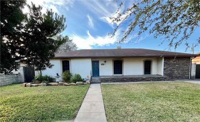 ranch-style home with a front lawn