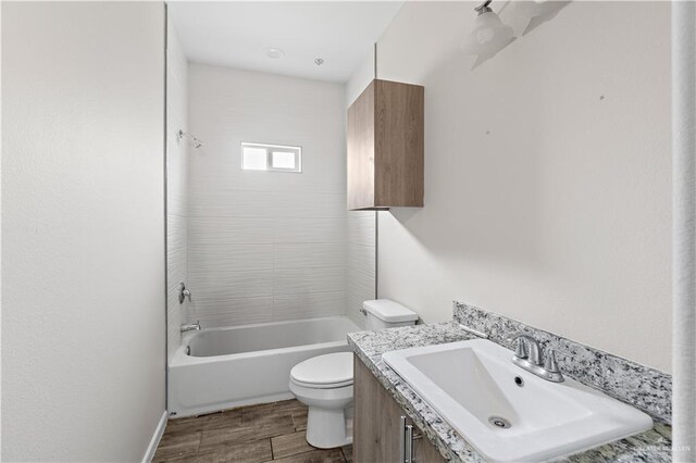 912 Kentucky St, Alton, TX 78573 - full bath with toilet, bathtub / shower combination, wood finished floors, and vanity