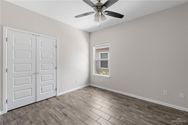 912 Kentucky St, Alton, TX 78573 - unfurnished bedroom featuring wood finished floors, baseboards, and a closet