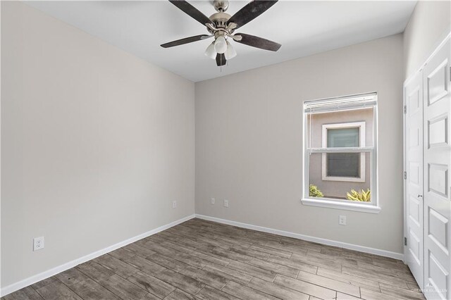 912 Kentucky St, Alton, TX 78573 - spare room featuring wood finished floors, ceiling fan, and baseboards