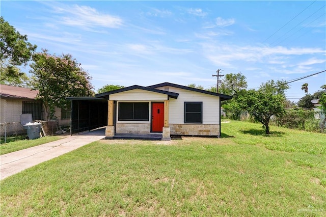 1125 W Schunior St, Edinburg, TX 78541 - view of front of property with stone siding, concrete driveway, an attached carport, and a front lawn