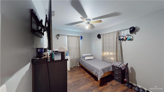 bedroom with ceiling fan and dark hardwood / wood-style floors