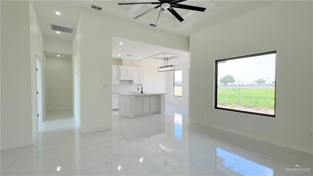 interior space with ceiling fan and sink