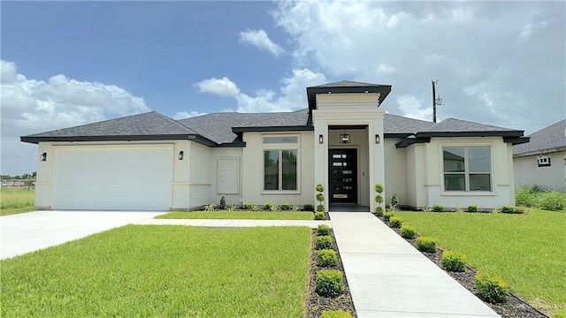 prairie-style house with a garage and a front lawn