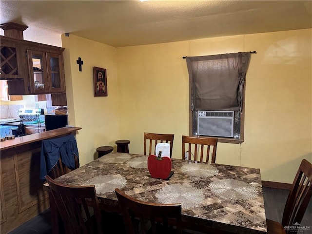 dining space featuring cooling unit