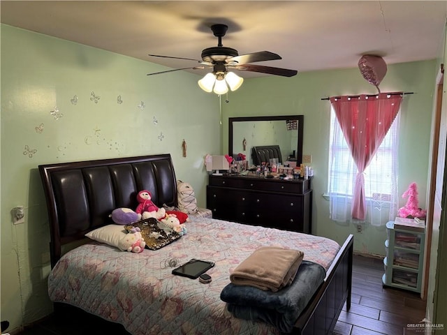 bedroom featuring a ceiling fan and wood finished floors