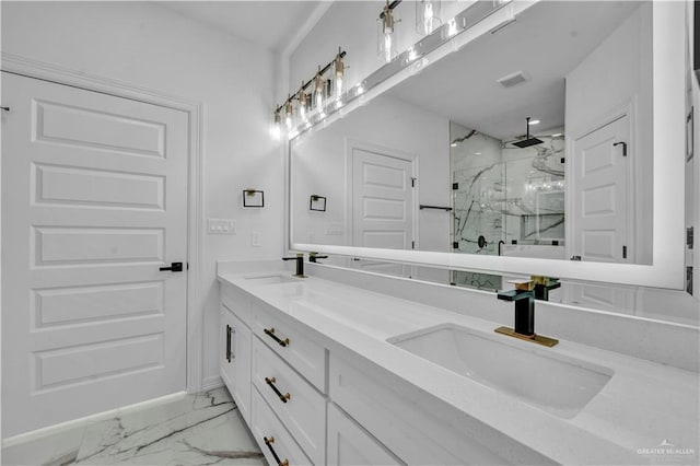 bathroom featuring marble finish floor, visible vents, a sink, and a marble finish shower