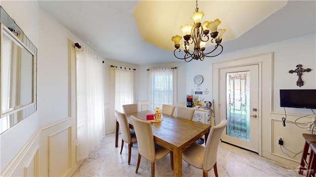 dining space with a chandelier