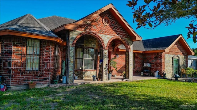 back of house with a yard