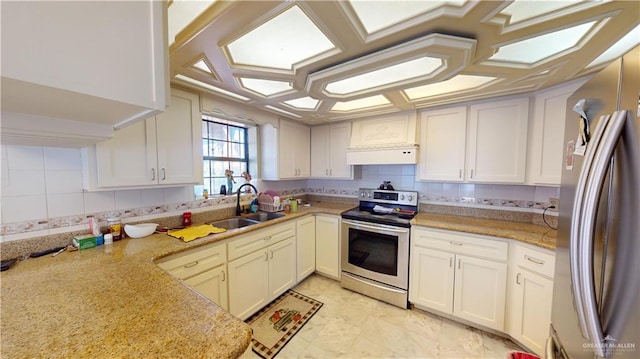 kitchen with exhaust hood, white cabinets, sink, light stone countertops, and appliances with stainless steel finishes