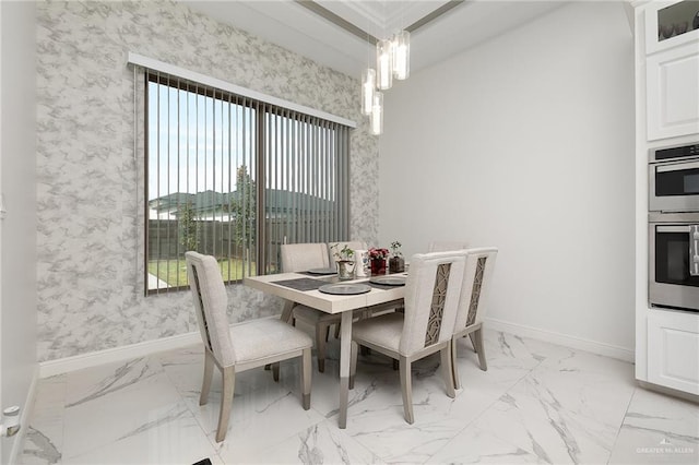 dining area with an inviting chandelier