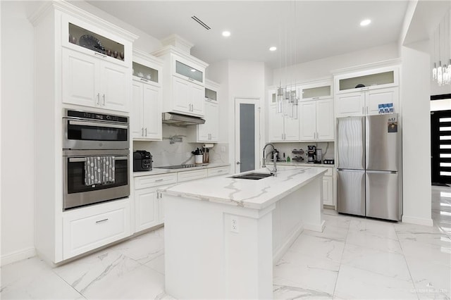 kitchen featuring white cabinetry, sink, an island with sink, and stainless steel appliances