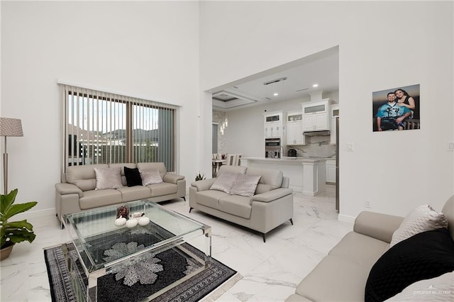 living room with a towering ceiling