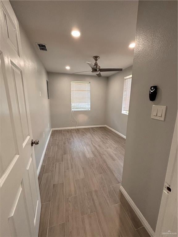 1012 S Inspiration Rd, Mission, TX 78573 - empty room featuring wood finished floors, baseboards, ceiling fan, and recessed lighting