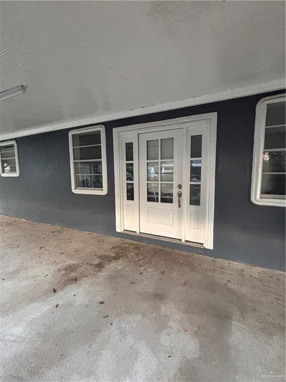 1012 S Inspiration Rd, Mission, TX 78573 - property entrance featuring stucco siding and french doors