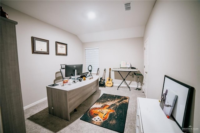 office with light colored carpet and lofted ceiling