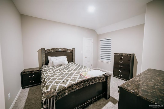 bedroom featuring carpet and lofted ceiling