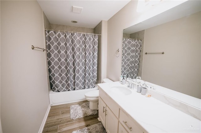 full bathroom with hardwood / wood-style flooring, vanity, toilet, and shower / bathtub combination with curtain