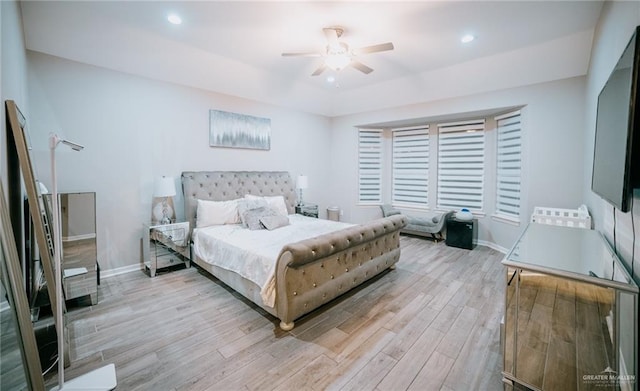 bedroom featuring light hardwood / wood-style floors and ceiling fan