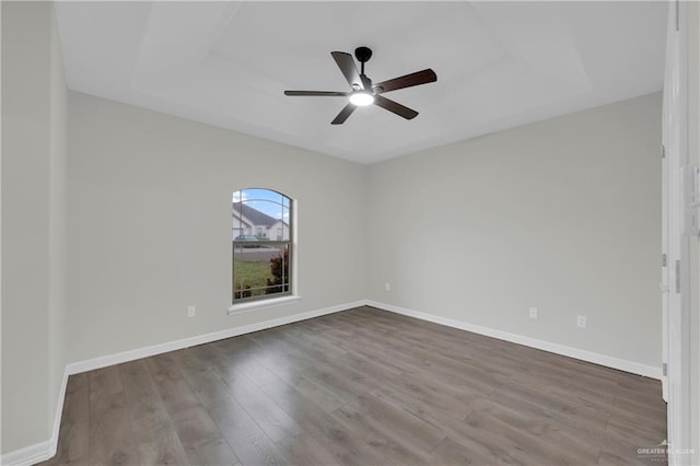 spare room with ceiling fan and hardwood / wood-style flooring