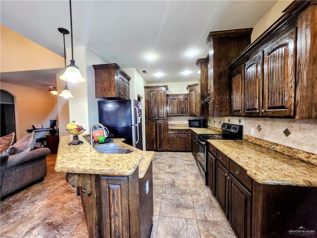 kitchen featuring black appliances, sink, hanging light fixtures, light stone countertops, and dark brown cabinets