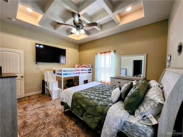 bedroom featuring ceiling fan, beam ceiling, and coffered ceiling