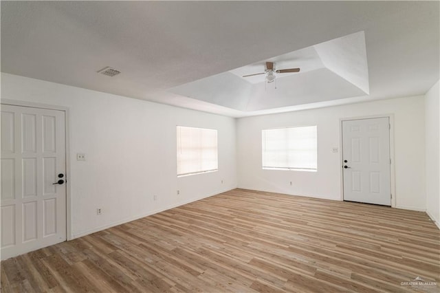 420 N Beto Garcia Dr, Weslaco, TX 78596 - foyer with a raised ceiling, a ceiling fan, light wood finished floors, and baseboards