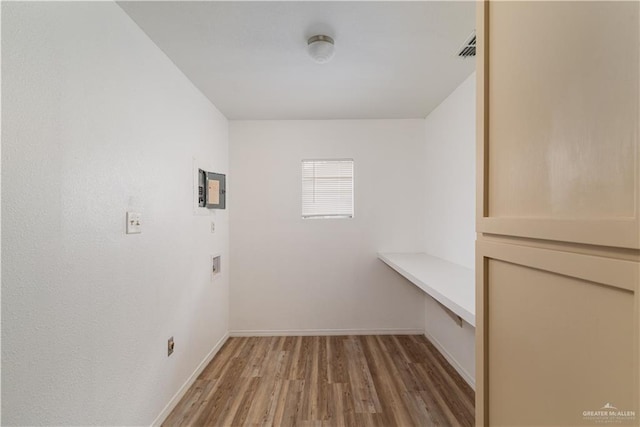 420 N Beto Garcia Dr, Weslaco, TX 78596 - walk in closet with light wood-type flooring