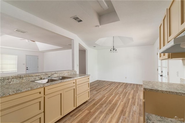 420 N Beto Garcia Dr, Weslaco, TX 78596 - kitchen with a sink, light wood-type flooring, and decorative light fixtures